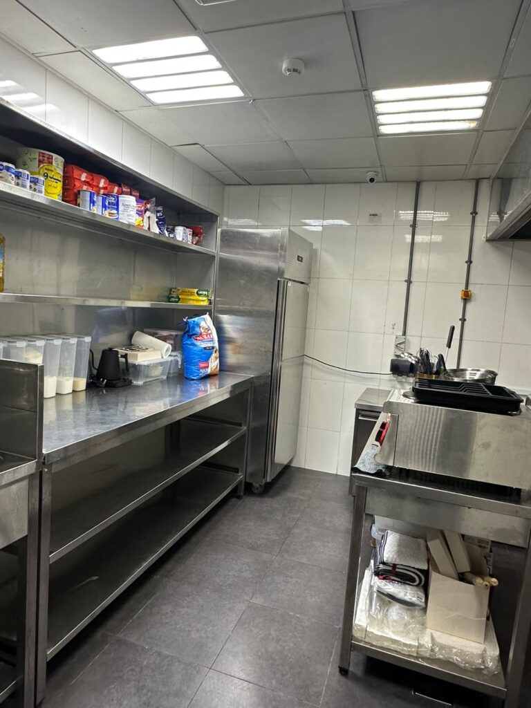 Storage shelving and preparation area at Kitchen Works in Al Quoz 4, Dubai